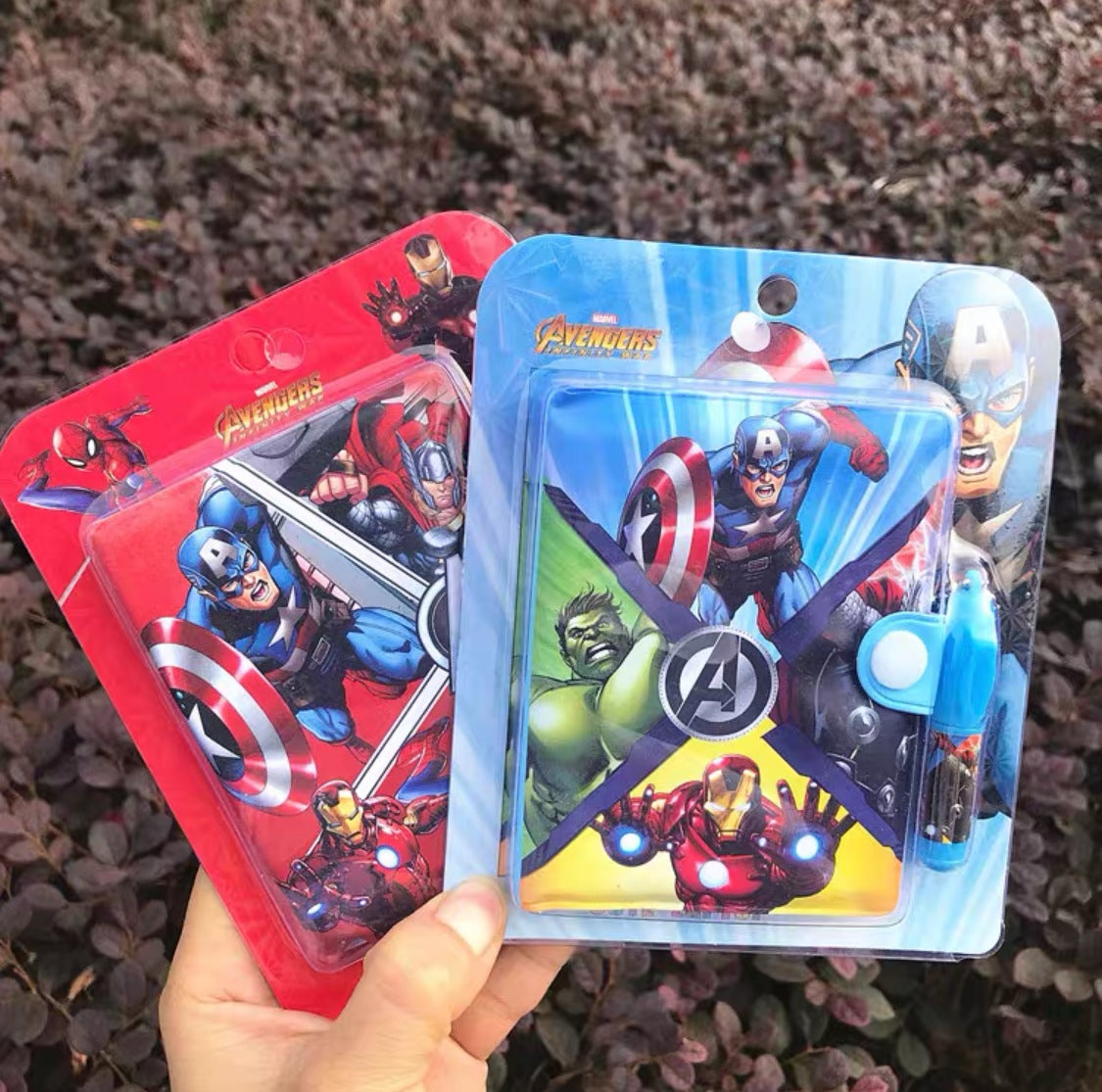 Superhero Notebook available in red and blue packaging with superhero characters.