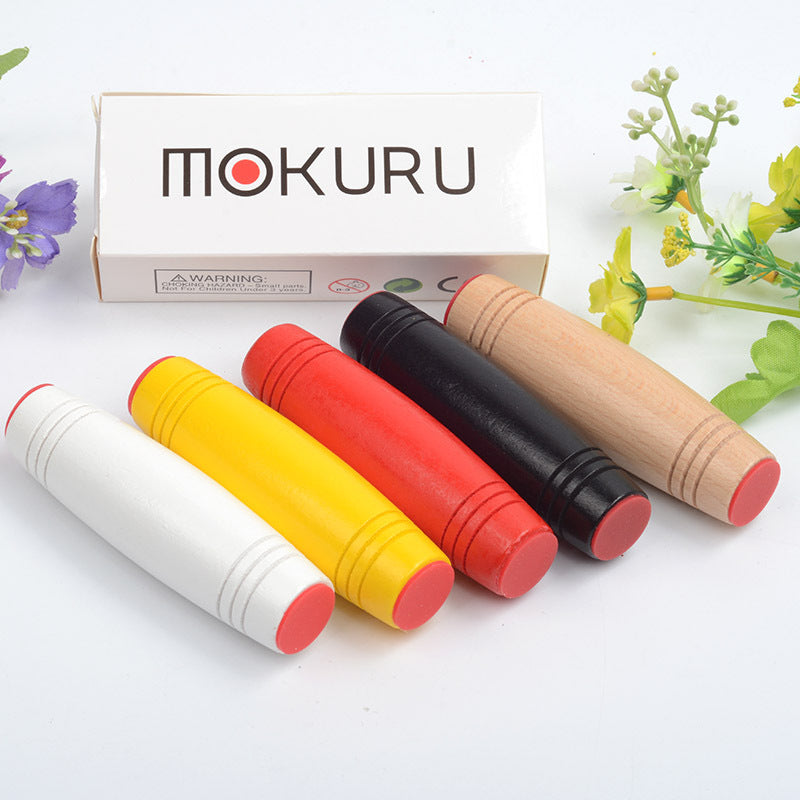 Mokuru fidget toy in multiple colors with smooth rolling action and Mokuru branded packaging