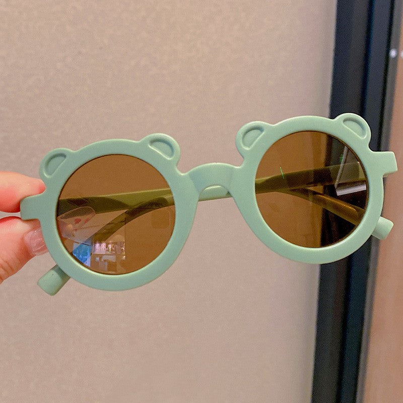 Kids Sunglasses in bear-shaped frame, stylish and fun accessory for children.