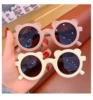 Nordic kids sunglasses in playful designs and random colors.