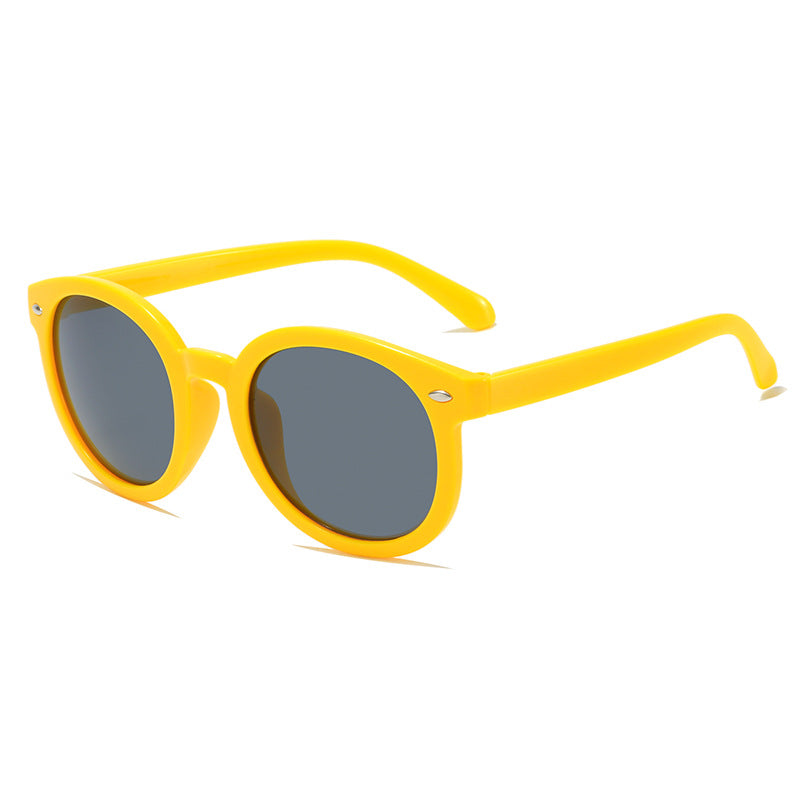 Yellow kids sunglasses with round dark lenses, lightweight and stylish for children