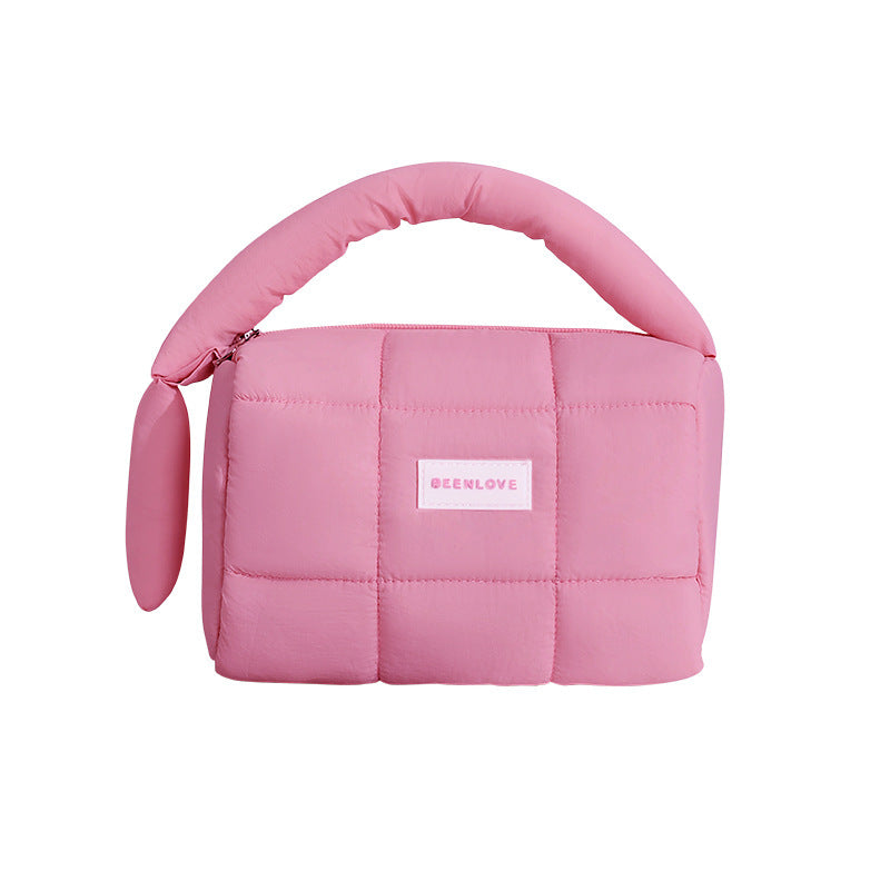 Puffer Travel Pouch in pastel colors for organized travel storage